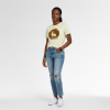 A young black female model wearing the cream serengeti tee