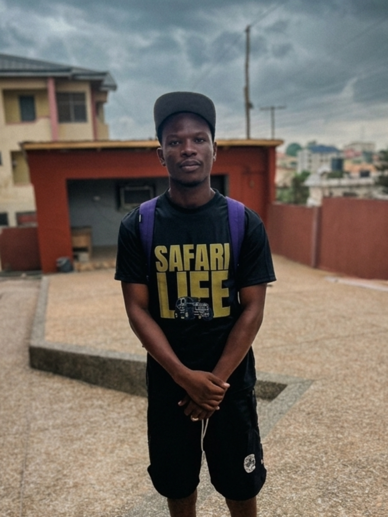 A young african guy in the black colorway of the Safari Life Tee from DripAfrika